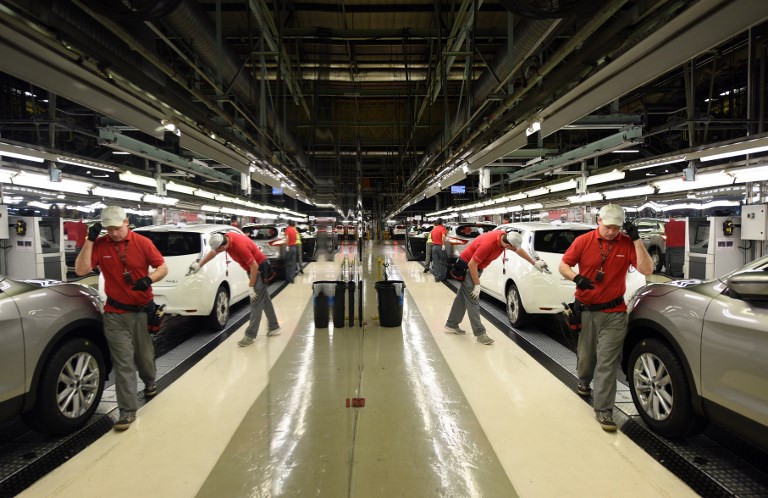 NISSAN PLANT. In this file photo taken on November 12, 2014, 'Check and Repair' members of Nissan's manufacturing staff work in the 'Trim and Chassis' section of their Sunderland Plant in Sunderland, England. File photo by Oli Scarff/AFP 