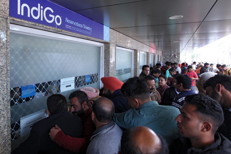 STRANDED. Passengers queue at airline counters following the shut down of the airspace for commercials flights north of Delhi as tensions increase with Pakistan, at Jammu airport in Jammu on February 27, 2019. Photo by Rakesh Bakshi/AFP 