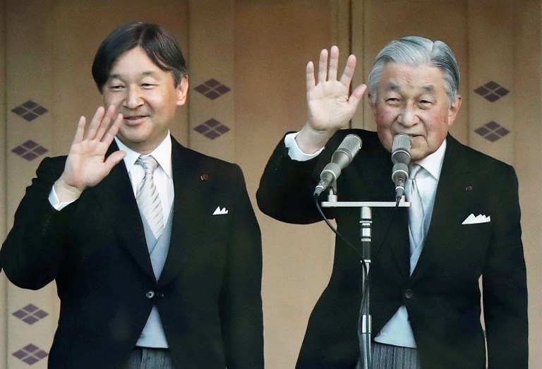 FATHER AND SON. Japan's Emperor Akihito (R) and Crown Prince Naruhito (L) wave to the crowd during the New Year's greeting ceremony at the Imperial Palace in Tokyo on January 2, 2019. Photo by Jiji Press/AFP 