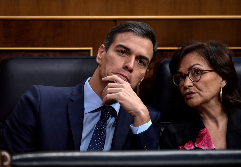 POLITICS. In this file photo, Spanish Prime Minister Pedro Sanchez (L) and Deputy Prime Minister and minister of equality Carmen Calvo attend commemorative acts marking the 40th anniversary of the Spanish Constitution at the parliament in Madrid on December 6, 2018. File photo by Oscar Del Pozo/AFP 