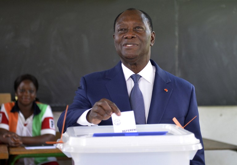 REFERENDUM. Ivory Coast President Alassane Ouattara casts his vote at a polling station in Abidjan on October 30, 2016, during a referendum on a new constitution. Photo by Sia Kambou/AFP 