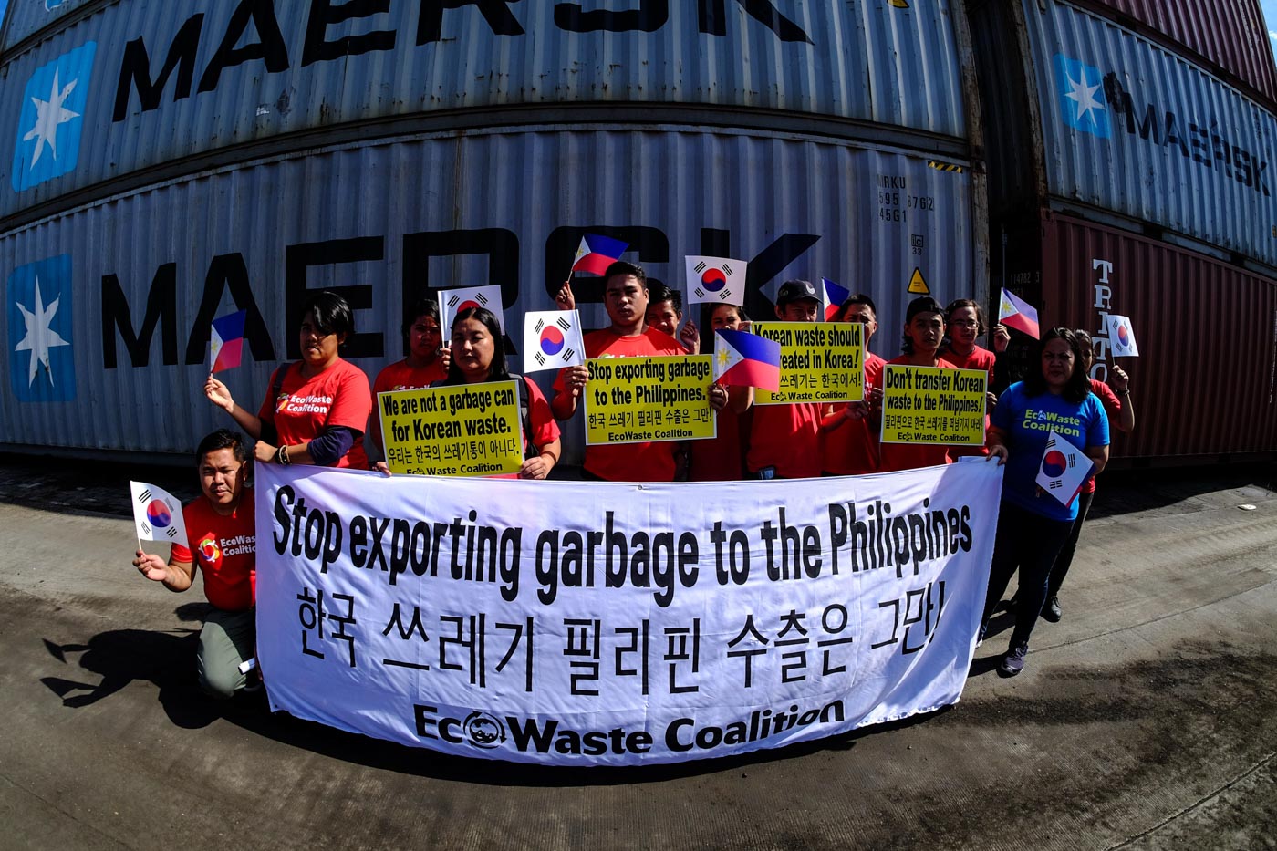 MISDECLARED CARGO. Members of the Ecowaste Coalition shows up signs condemning and protesting the importation of hazardous waste materials from South Korea inside the Mindanao International Container Terminal in Tagoloan, Misamis Oriental on Sunday, January 13,2019. The 1,400 tons of waste inside 51 40-footer containers will be ship back to South Korea onboard M/V Kalliroe on January 14,2019. Photo by Bobby Lagsa/Rappler 
