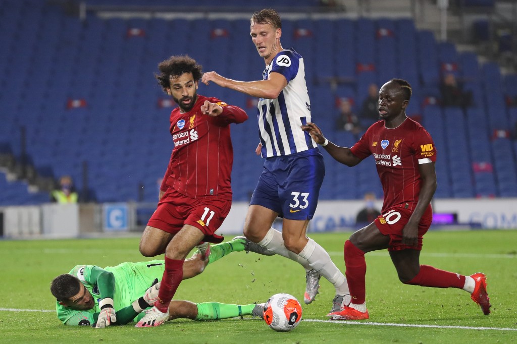 IN THE HUNT. Liverpool stars Mohamed Salah (left) and Sadio Mane (right) vie for the ball with Brighton's goalkeeper Mathew Ryan (on the ground) and towering defender Dan Burn.
Photo by Catherine Ivill /AFP 