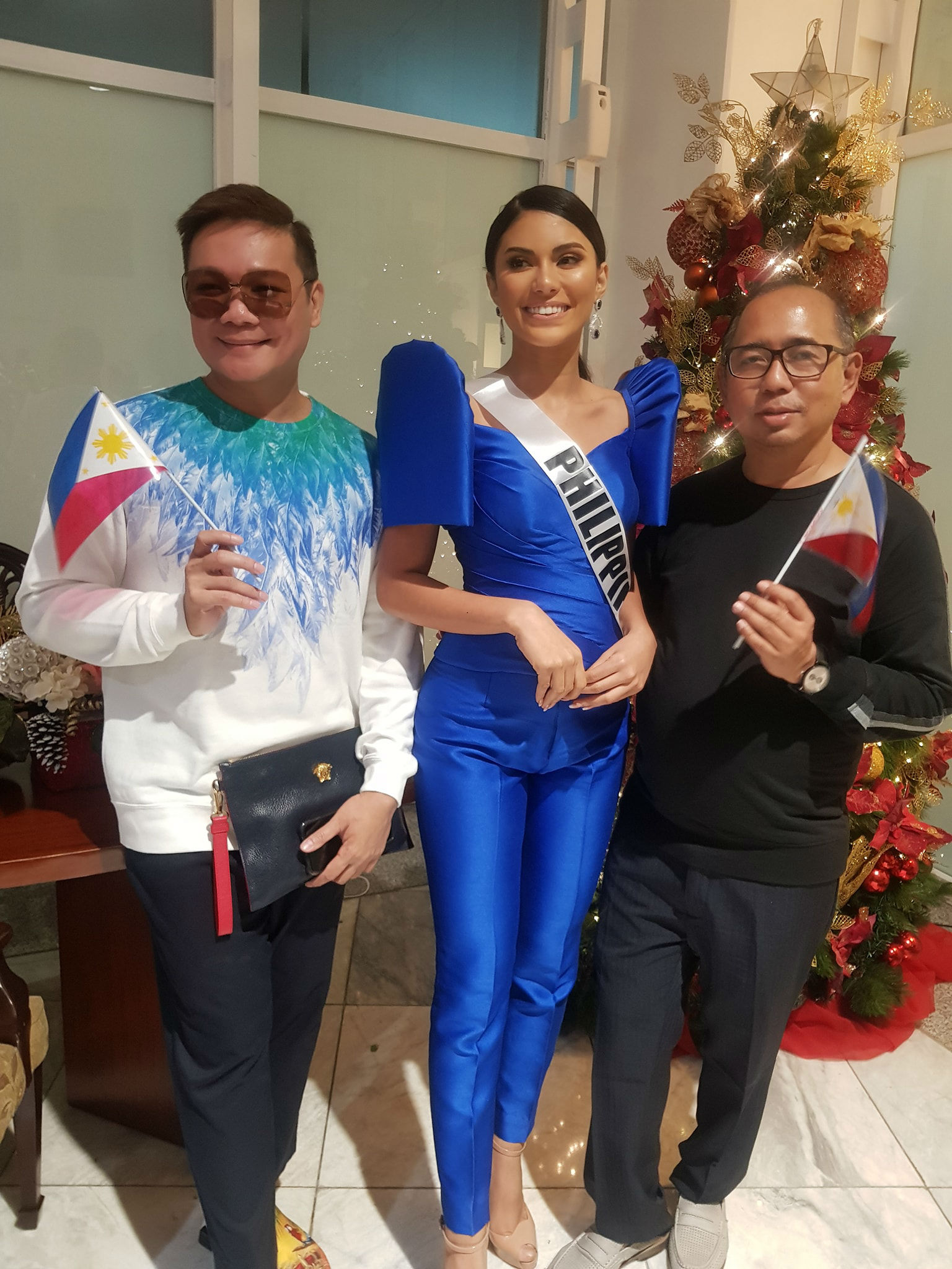 UNITED. Jonas Gaffud and Rodgil Flores pose with Gazini before her flight to the US. Photo from Facebook/Bb Pilipinas  