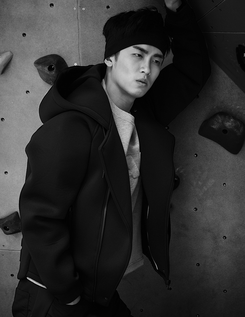 Junjie L. wears: Foam zipper hoodie over gray ‘WANG’ sweater and black trousers