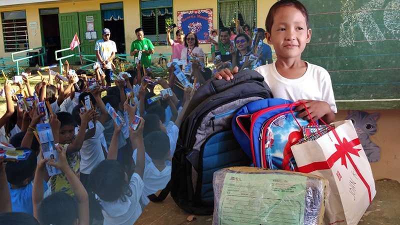 DONATIONS FOR JAN KIM. Jan Kim Enario and his classmates at the Union Elementary School receive donations from concerned netizens and institutions. Photo by Maricor Baculanta 