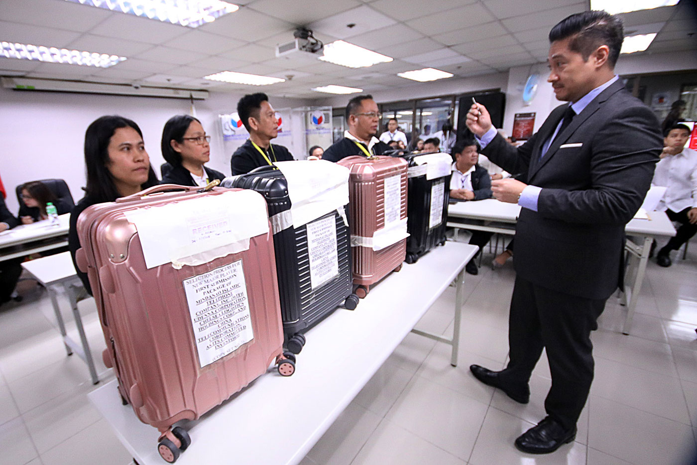 BLACK AND PINK. Bid documents of Mislatel in rose pink and black pieces of luggage. Photo by Darren Langit/Rappler  