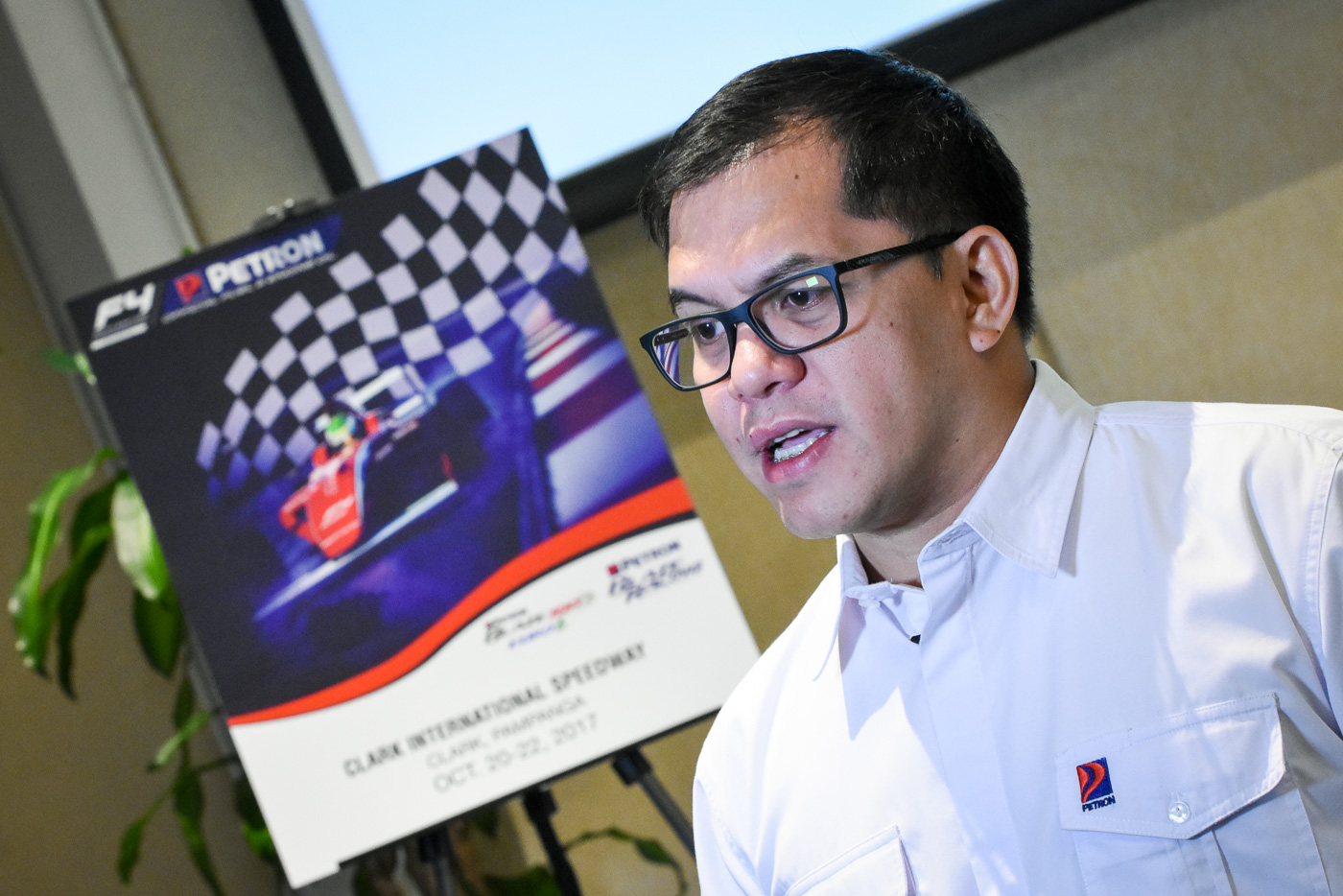 THE FORMULA DREAM. Local Station Marketing Head Bong Paguia announces that Petron products will be used by F4 racers in Malaysia, the Philippines, Indonesia, and Thailand. All photos by Leanne Jazul/Rappler 