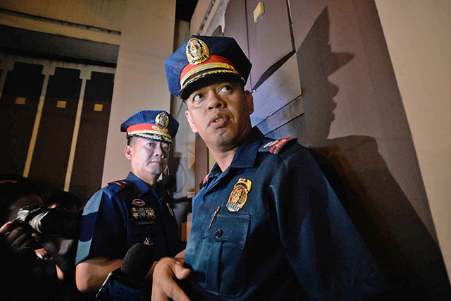 ENOUGH ACTION? The Quezon City Police District led by Chief Superintendent Pagdilao visit the INC compound in Tandang Sora past 11 pm on Thursday, July 23. Photo by Alecs Ongcal/Rappler Photo by Alecs Ongcal/Rappler