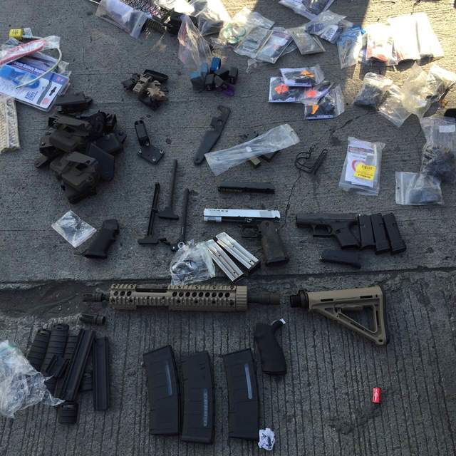 SEIZED. Intelligence agents of the customs bureau find gun parts inside two tractors and a motorcycle in a container van at a Cagayan de Oro extension port. Photo courtesy of Bureau of Customs 