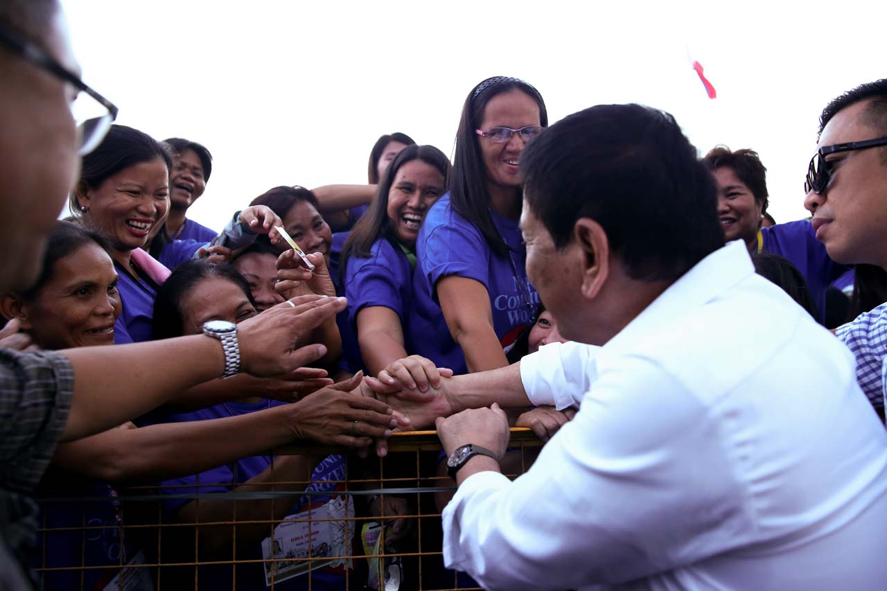 FEMALE FANS. Women take turns shaking President Duterte's hands during a Nanay Volunteers event in December 2016. Photo by Karl Norman Alonzo/Presidential Photo  