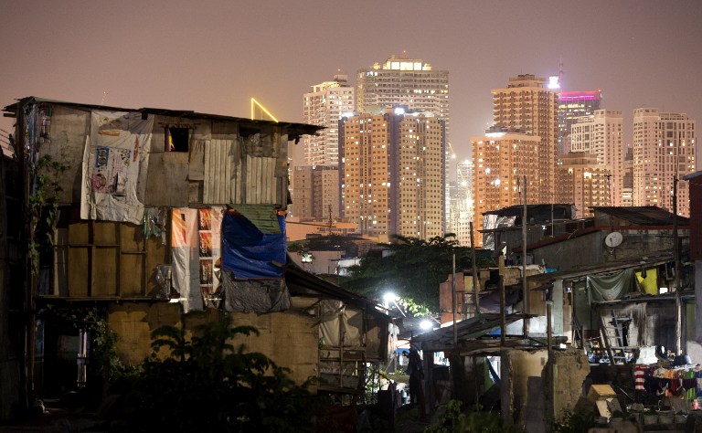 MANILA SNAPSHOT. While there are pockets of development, most of Manila City continues to be underdeveloped. Photo by Noel Celis/AFP 