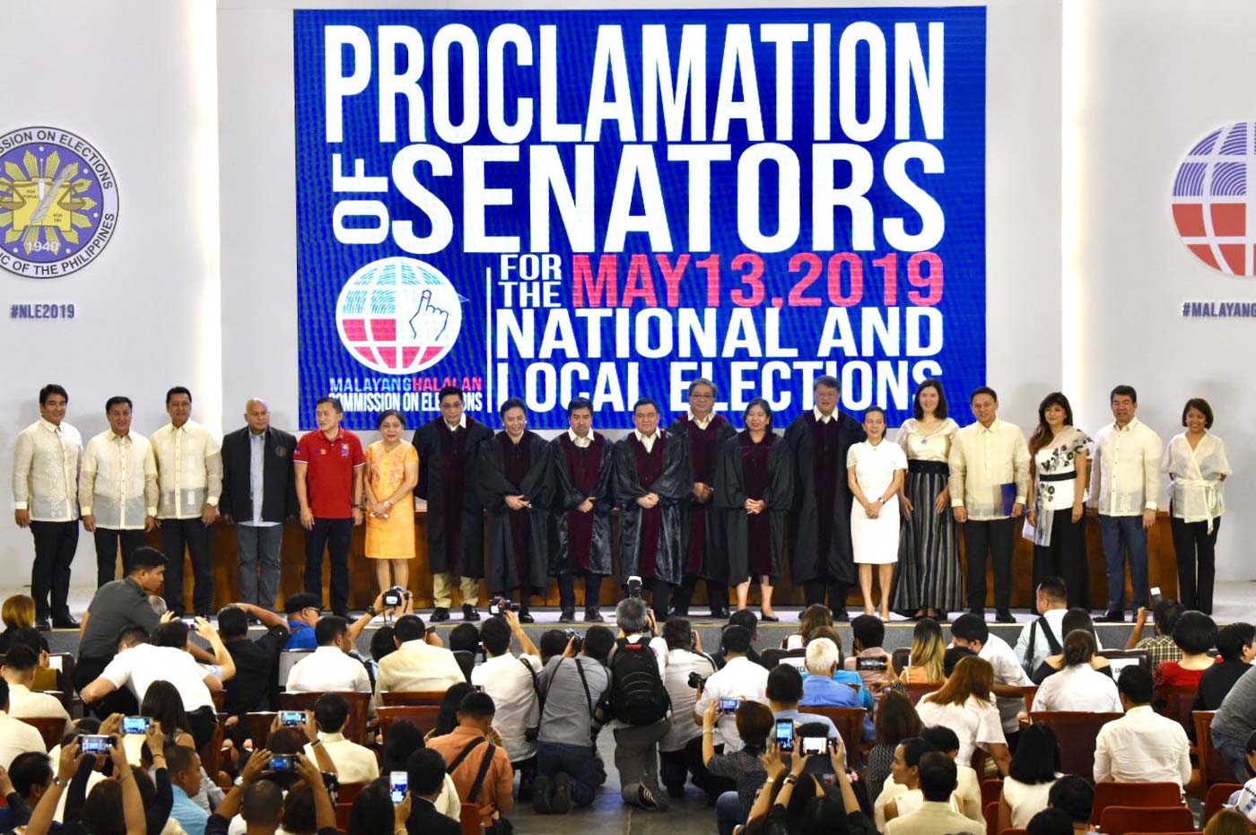 WINNING senators pose with the 7 members of the Commission on Elections after their proclamation on May 22, 2019. Photo by Angie de Silva/Rappler
