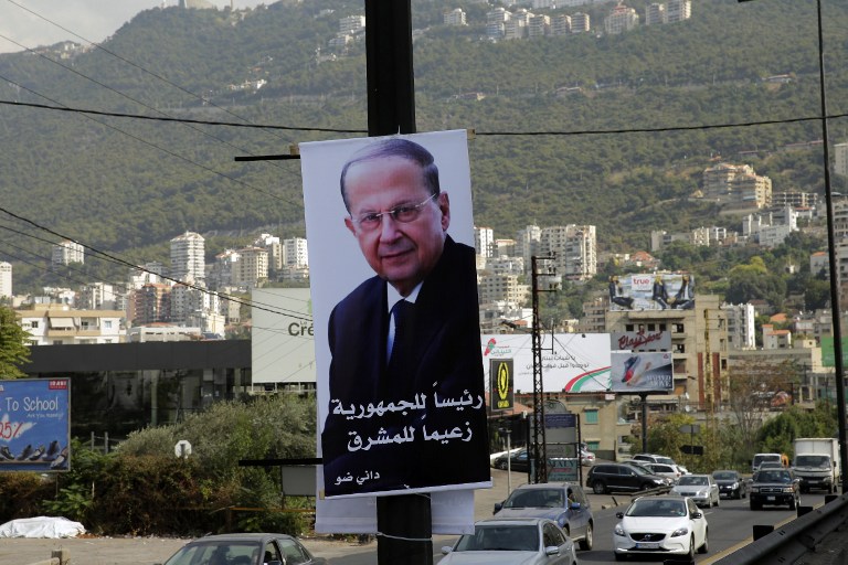 A giant poster that bears the portrait of Lebanese presidential candidate Michel Aoun is seen hanging on a pole on the Jounieh highway, north of the capital Beirut on October 28, 2016. Joseph Eid/AFP 