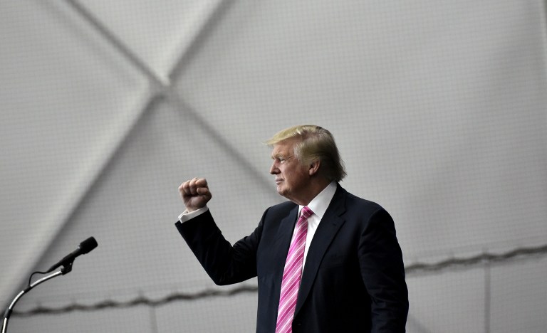 Republican presidential nominee Donald Trump gestures following a rally at Spooky Nook Sports center in Manheim, Pennsylvania on October 1, 2016. / AFP PHOTO / Mandel Ngan 