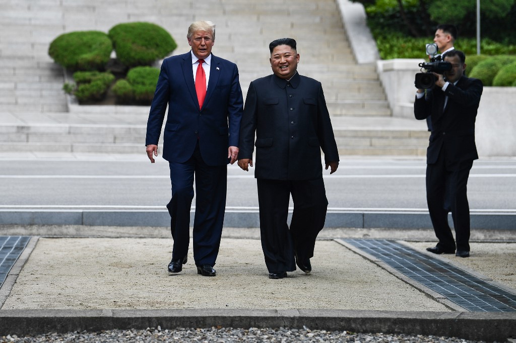 NO MORE SUMMITS? In this file photo, North Korea's leader Kim Jong-un walks with US President Donald Trump north of the Military Demarcation Line that divides North and South Korea, in the Joint Security Area of Panmunjeom in the Demilitarized zone on June 30, 2019. File photo by Brendan Smialowski/AFP 