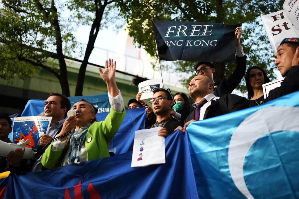 REBIYA KADEER. Uighur democracy leader Rebiya Kadeer (C) speaks during a demonstration flanked by free tibet activists and Hong Kong protesters in Osaka on June 28, 2019 against a controversial extradition bill in Hong Kong, during the G20 summit. Photo by Charly Triballeau/AFP 