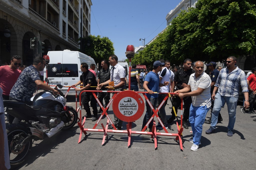 AFTERMATH. Tunisian security forces cordon off the site of an attack in the Tunisian capital's main avenue Habib Bourguiba on June 27, 2019. Photo by Fethi Belaid/AFP 