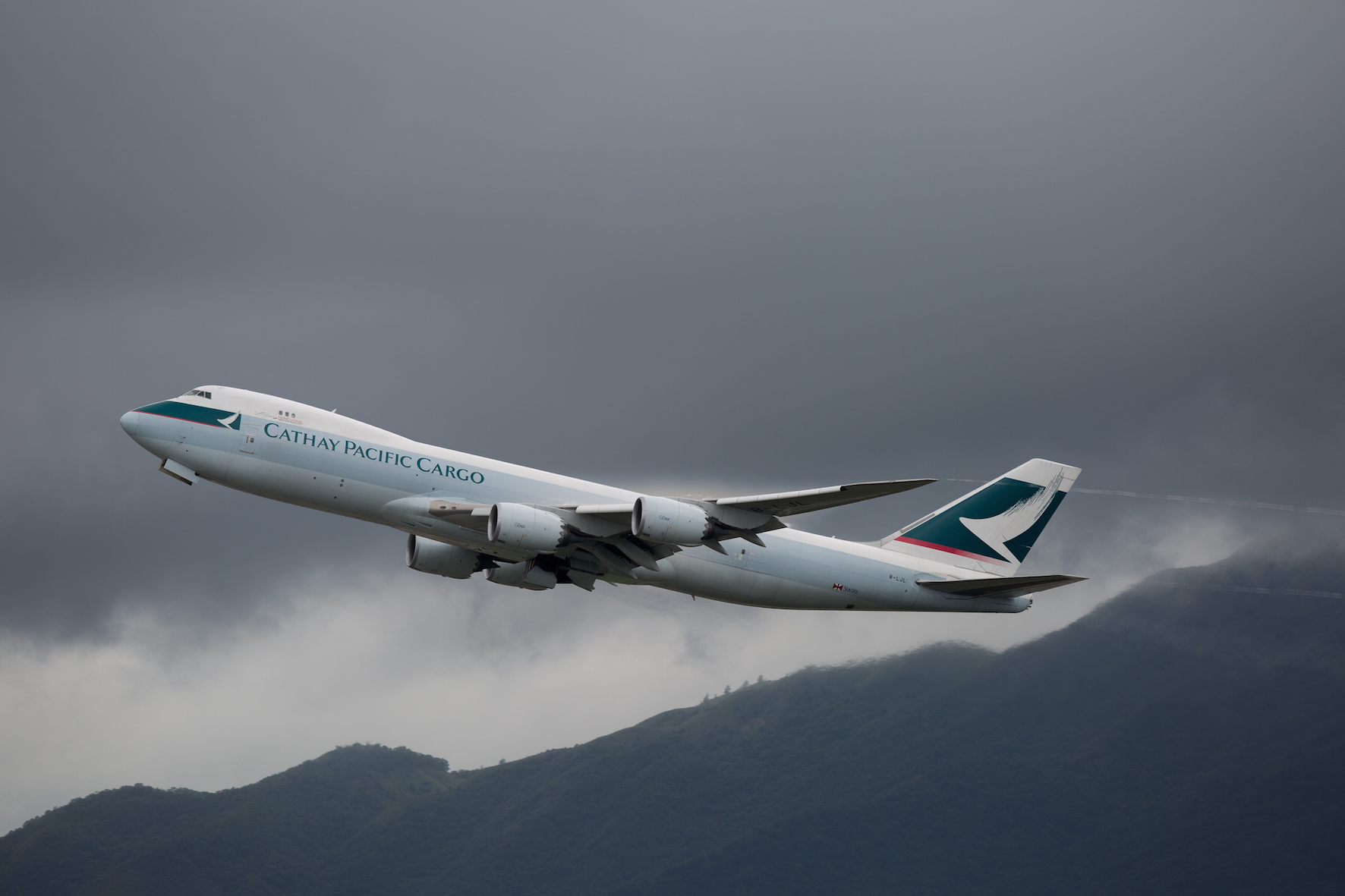 HUGE DECLINE. A Cathay Pacific cargo plane takes off from Hong Kong International Airport on August 17, 2016. Photo by Jerome Favre/EPA  