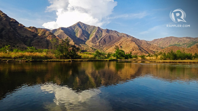 QUIET LAKE AND MOUNTAINS. Afternoon is also the best time to trek inland and see the golden mountains beautifully reflected on Nagsasa’s quiet lake 