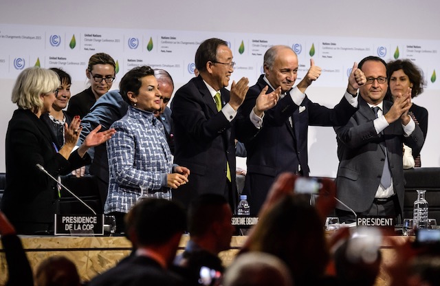 In this file photo dated December 12, 2015, several world leaders celebrate after the adoption of the COP21 Paris agreement at the World Climate Change Conference 2015 (COP21) in Le Bourget, north of Paris, France.  Photo by Christophe Petit Tesson/EPA 