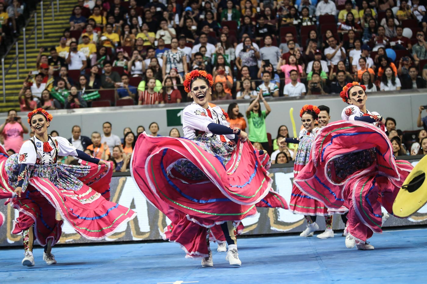 #VAMOSNationalU. The NU Pep Squad brings more life to its routine with the vibrant colors of Mexico. Photo by Josh Albelda/Rappler  
