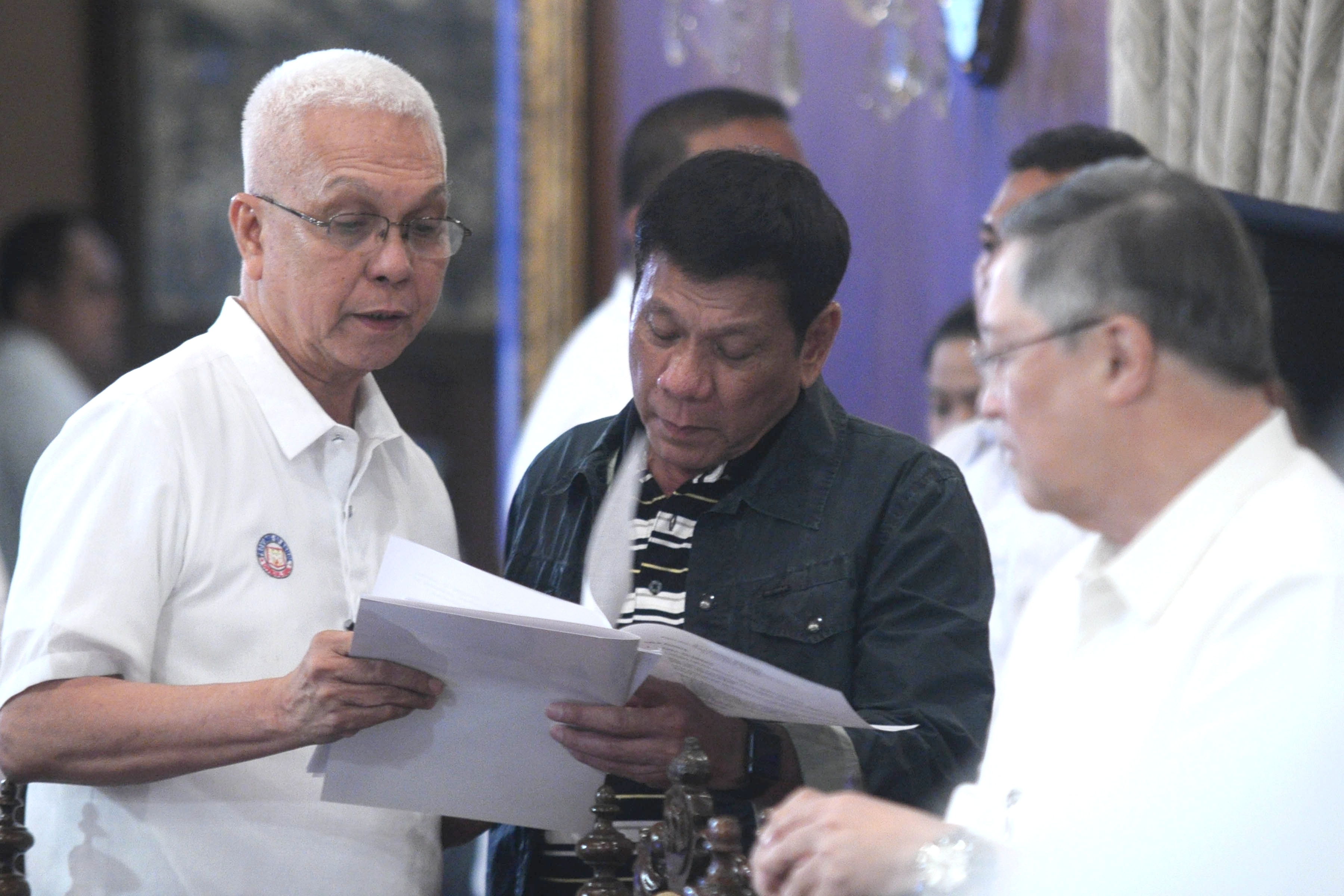 UNDER EVASCO'S OFFICE. Cabinet Secretary Leoncio Evasco Jr (left) is in charge of the 8888 Citizens' Hotline and Complaint Center, to work closely with Special Assistant to the President Christopher Go. Photo by King Rodriguez/Malacañang PPD  