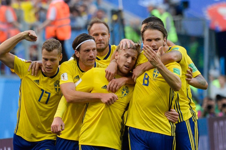 GAME-WINNER. Sweden's midfielder Emil Forsberg (center) gets congratulated by his teammates after scoring a goal. Photo by Olga Maltseva/AFP 