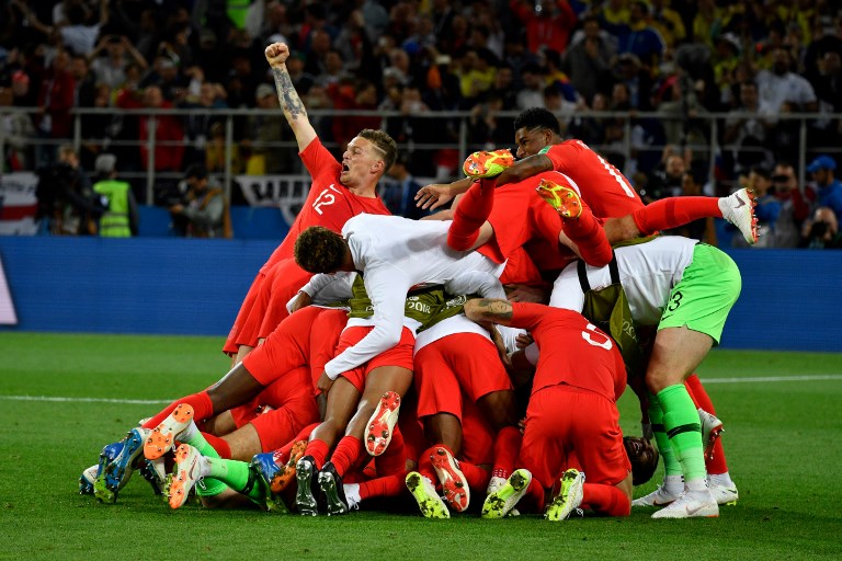 PILE OF JOY. England players celebrate after ending a string of shootout heartaches. Photo by Alexander Nemenov/AFP 