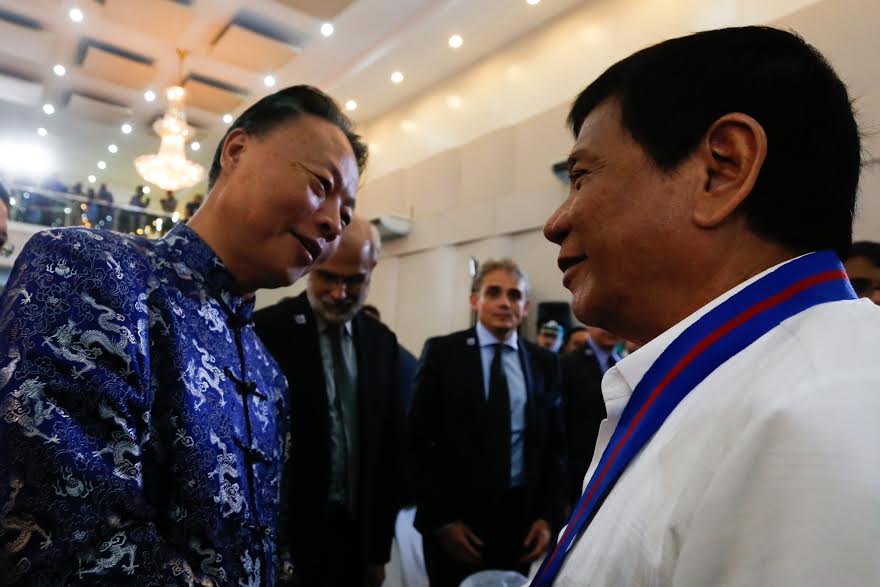 PH-CHINA TIES. President Rodrigo Duterte chats with Chinese Ambassador to the Philippines Zhao Jianhua at the 115th anniversary of the Philippine National Police in Camp Crame on August 17, 2016. File photo by Toto Lozano/PPD 