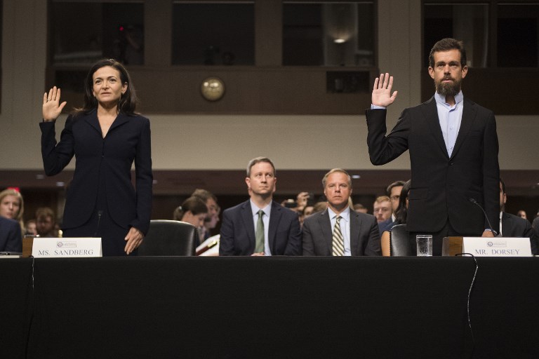 UNDER OATH. CEO of Twitter Jack Dorsey (r) and Facebook COO Sheryl Sandberg (l) are sworn in to testify before the Senate Intelligence Committee on Capitol Hill in Washington, DC, on September 5, 2018. Photo by Jim Watson/AFP 