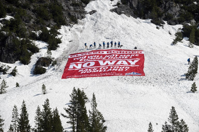 CLOSED. Activists from the French far-right political movement Generation Identitaire (GI) and European anti-migrant group Defend Europe conduct an operation titled "Mission Alpes" to control access of migrants using the Col de l'Echelle mountain pass on April 21, 2018 in Nevache, near Briancon, on the French-Italian border. Photo by Romain Lafabregue/AFP  