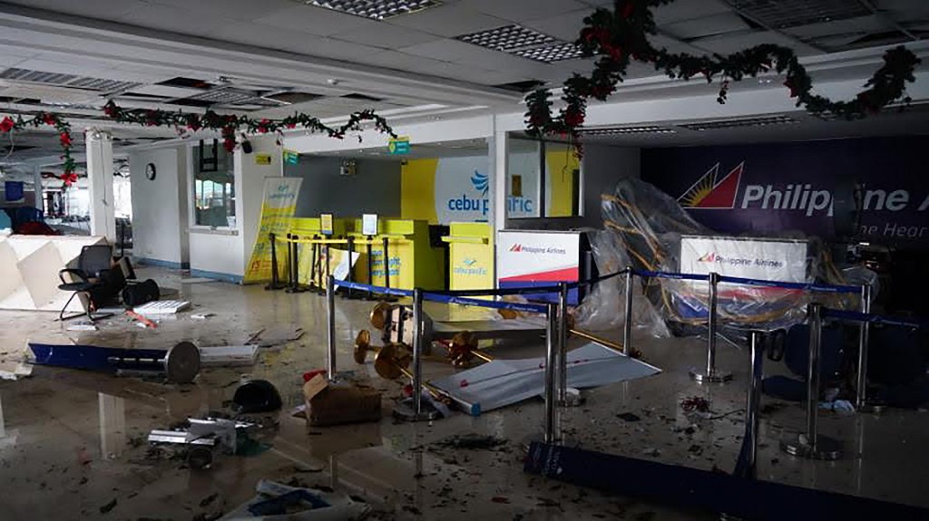 LEGAZPI AIRPORT. Debris litter inside the passenger terminal of the Legazpi Airport after one of its walls was destroyed after Typhoon Tisoy battered the province. Photo by Simvale Sayat/AFP 