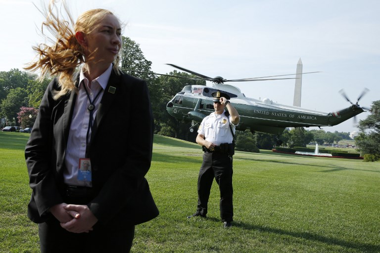 PROTECTING POTUS. This file photo taken on July 22, 2017 shows US Secret Service agents standing guard as Marine One helicopter with President Donald Trump on board departs the White House in Washington, DC. Yuri Gripas/AFP 