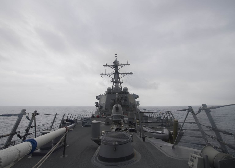 This US Navy photo obtained August 10, 2017 shows the Arleigh Burke-class guided-missile destroyer USS John S. McCain (DDG 56) as it patrols the South China Sea on January 7, 2017. A US warship on August 10, 2017 sailed close to an artificial island China has built up in the South China Sea. File photo by James Vazquez/US Navy/AFP  