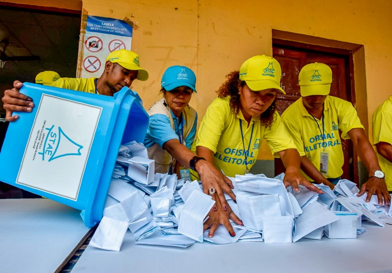 VOTE COUNT. Election officials open a ballot box during counting for the parliamentary election in Dili on July 22, 2017. Valentino Dariell De Sousa/AFP 