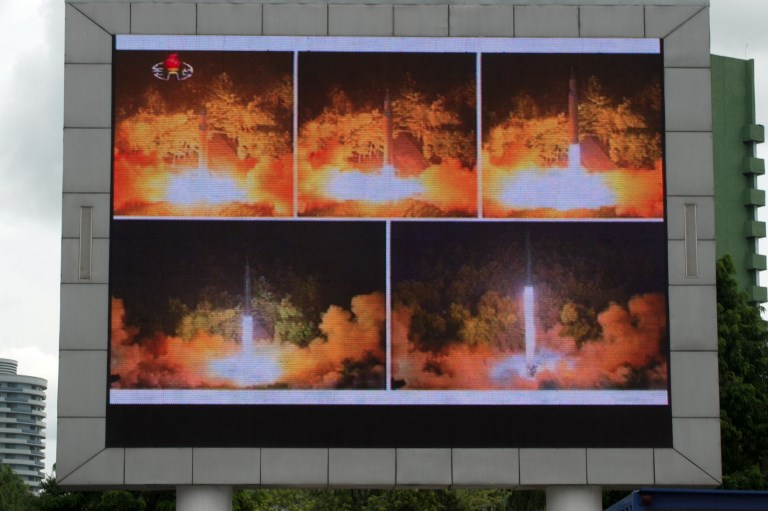 In this file photo, coverage of an ICBM missile test is displayed on a screen in a public square in Pyongyang on July 29, 2017. Kim Won-Jin/AFP 