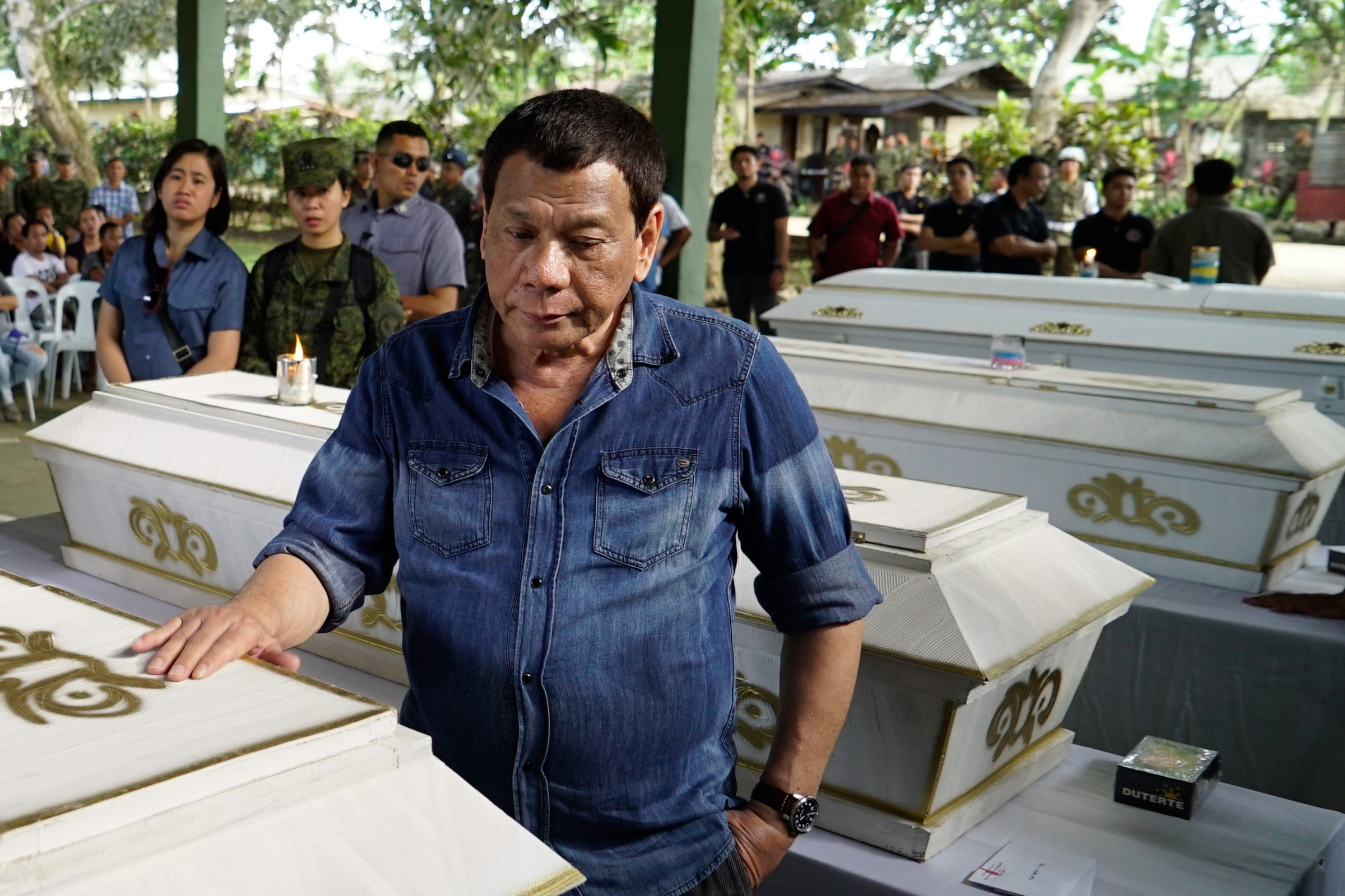 CONDOLENCES. President Rodrigo Duterte pays his last respects to one of the victims who died during the twin blasts at the Cathedral of Our Lady of Mount Carmel in Jolo, Sulu, as he visits Camp Teodulfo Bautista on January 28, 2019. Malacañang photo 