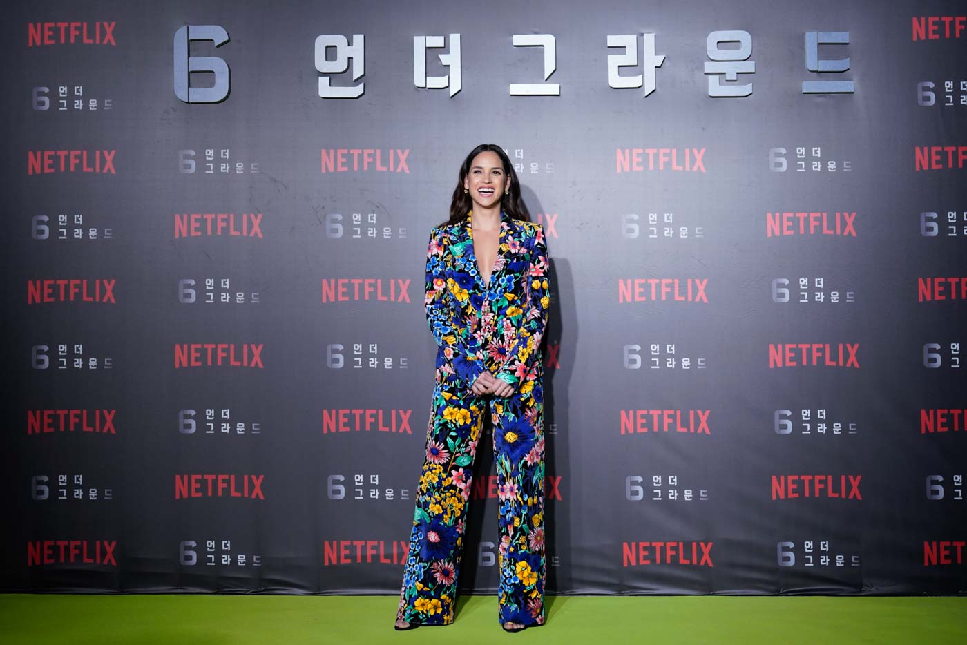 Enjoying Korea: Adria Arjona gives fans a bright smile despite the chilly weather in Seoul, South Korea at the world premiere of Netflix's '6 Underground' at Dongdaemun Design Plaza on December 02, 2019. Photo courtesy of Netflix 