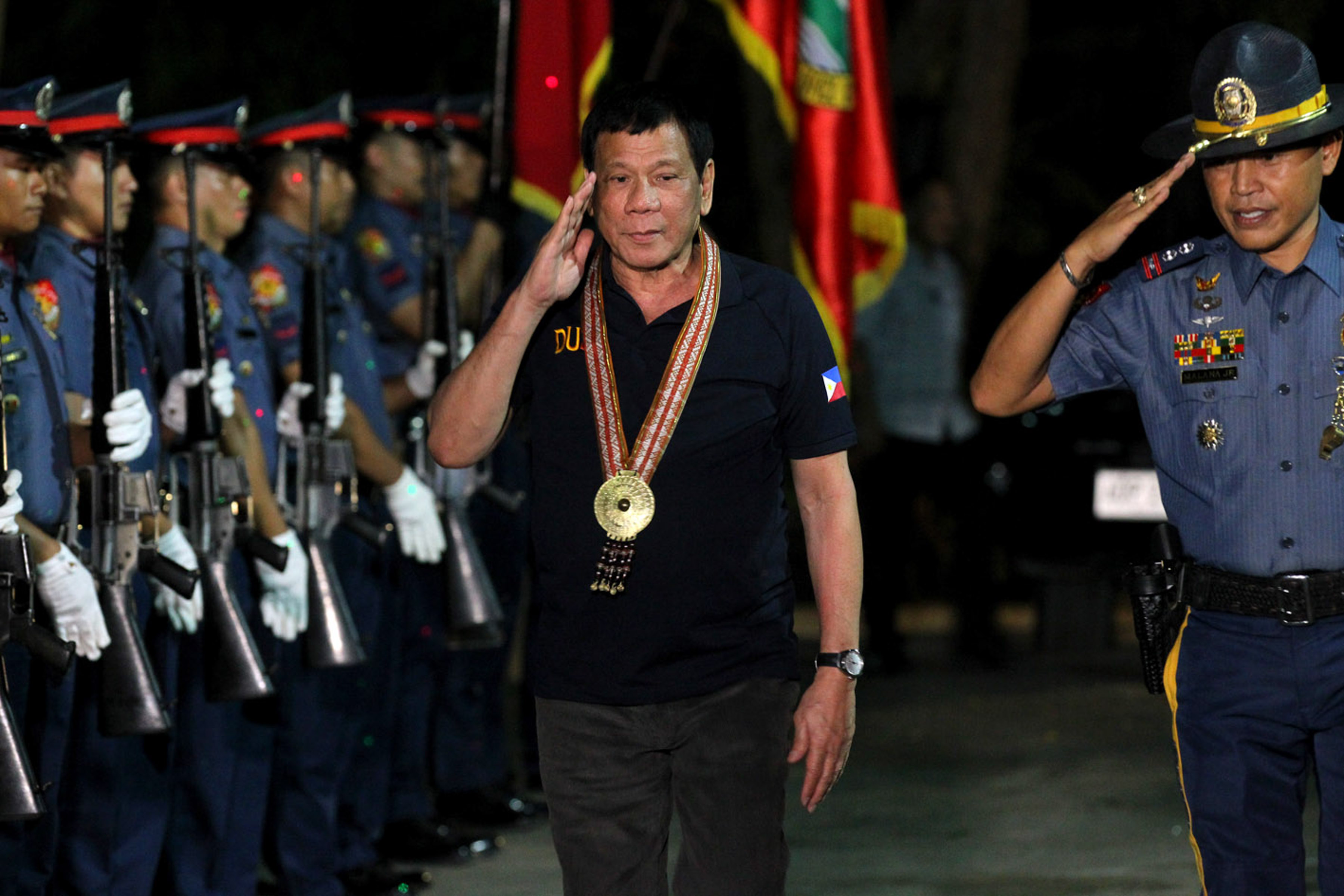 NO EXPLANATION NEEDED. President Rodrigo Roa Duterte salutes the police officers who welcomed him upon his arrival to attend the graduation ceremony of the Motorcycle Riding Course Class. Photo by Simeon Celis Jr/PPD 
