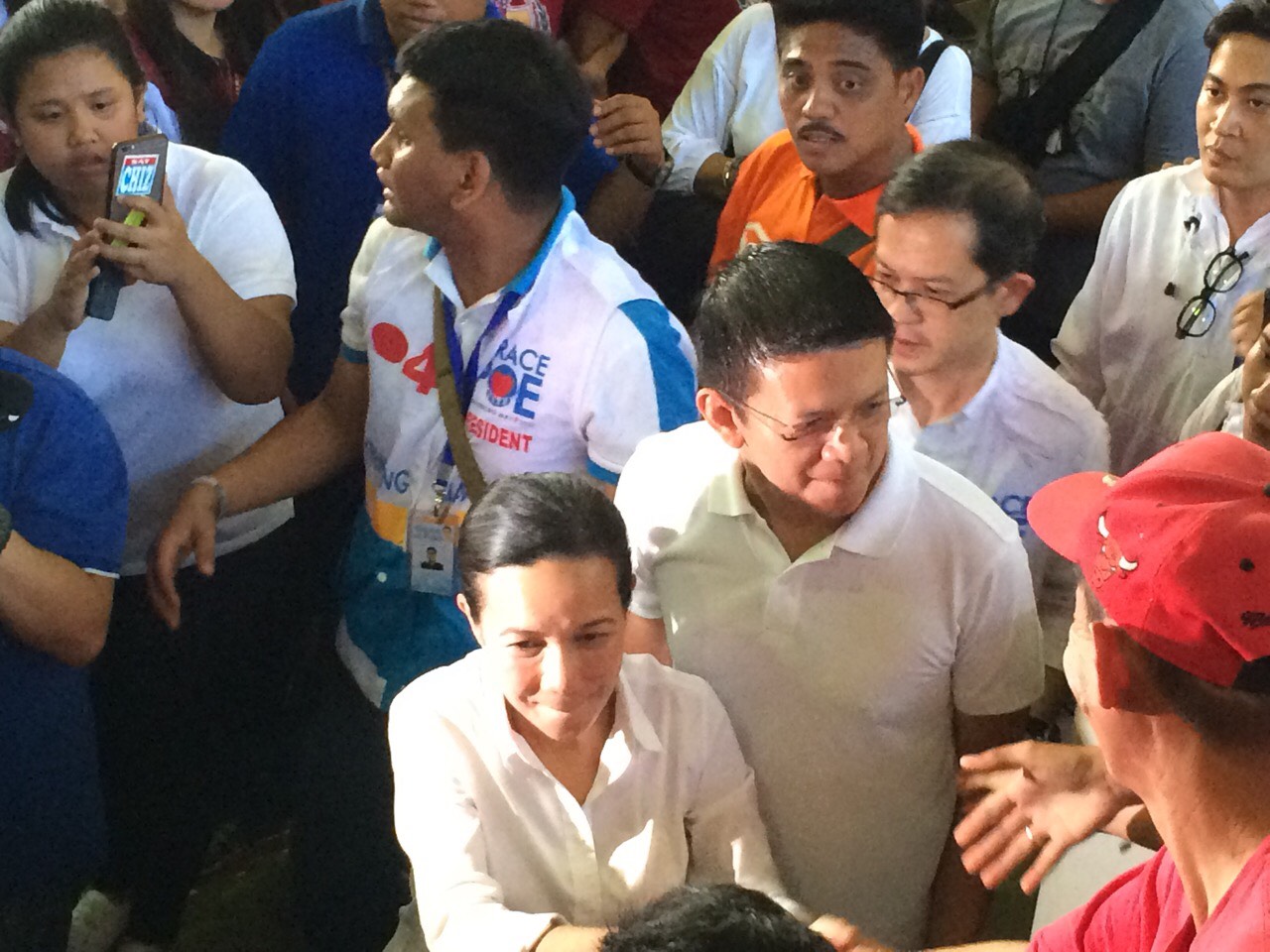 COJUANGCO CONNECTION. Presidential candidate Grace Poe and her running mate Francis Escudero are asked about their connection to businessman Eduardo 'Danding' Cojuangco Jr, during their sortie in Quezon province, where many beneficiaries of the coconut levy fund reside. Photo by Camille Elemia/Rappler 