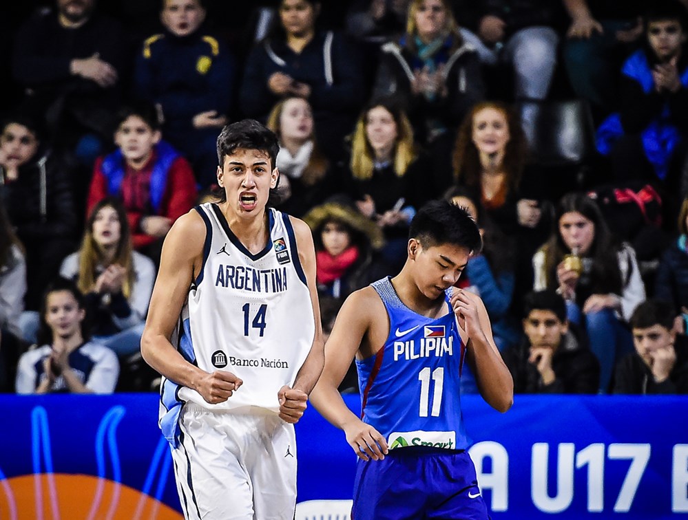 ONE FOR THE FANS. Leading scorer Juan Francisco Fernandez (left) savors host Argentina’s first win in the FIBA U17 World Cup at the expense of RC Calimag (right) and Batang Gilas, who finished winless in the group phase. Photo from FIBA   
