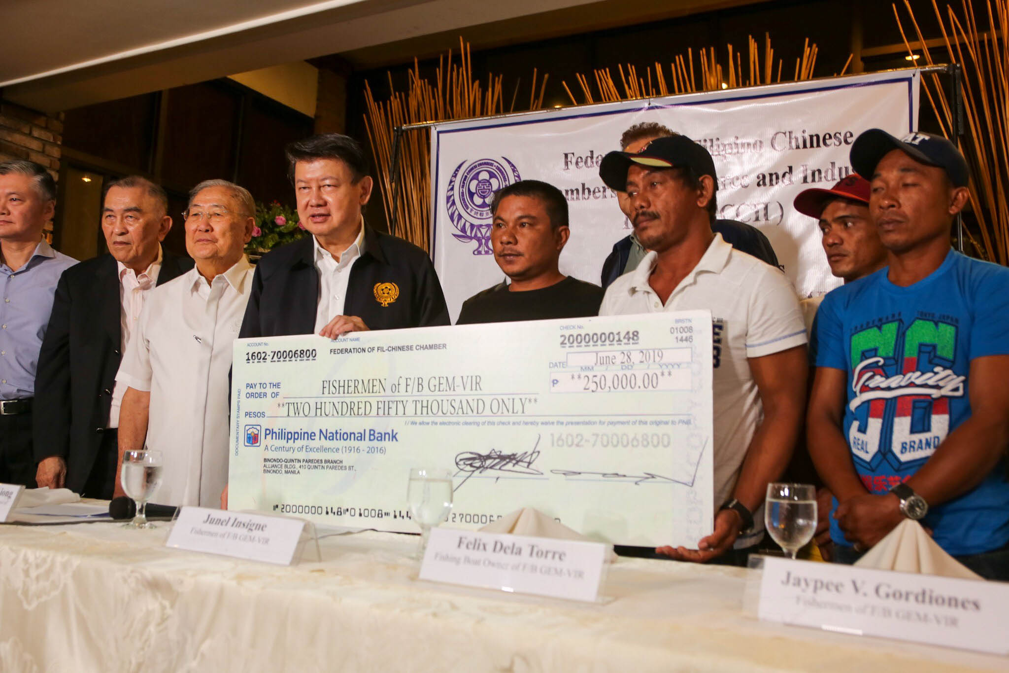 ASSISTANCE GIVEN. The FFCCCII formally turnover check donations and sacks of rice to the owner and fishermen of F/B Gem-Ver on at a press conference in Quezon City on June 28, 2019. Photo by Jire Carreon/Rappler 