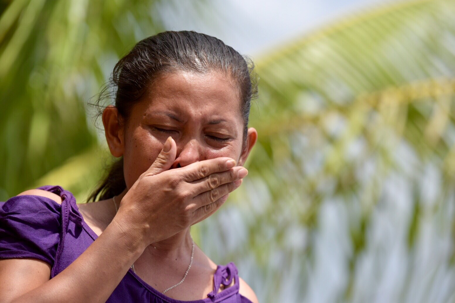 UNCERTAIN FUTURE. The wife of a fisherman of the sunken Gem-Ver is overcome by emotions while waiting for her husband. Photo by LeAnne Jazul/Rappler  