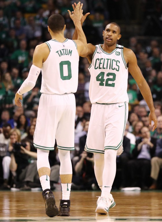 SERIES LEAD. Al Horford high fives Jayson Tatum as the Boston Celtics get the job done in their home court. Photo by Maddie Meyer/Getty Images/AFP 