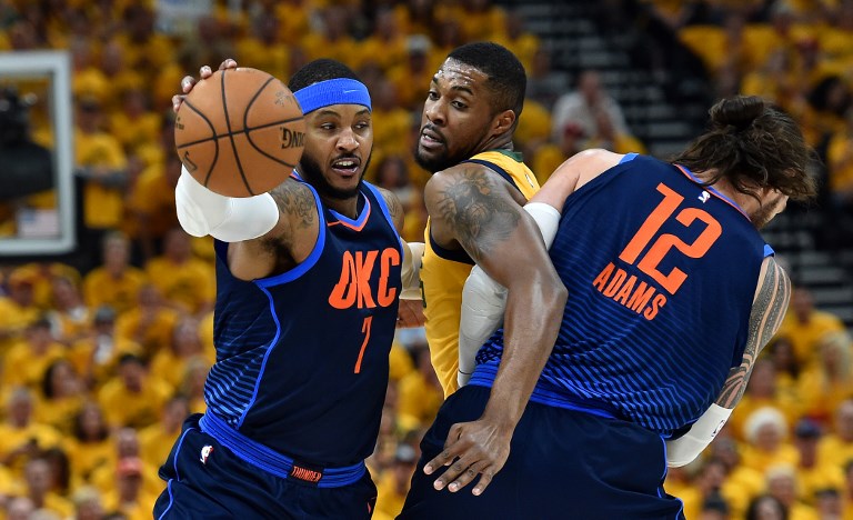 OUT OF THE WAY. Utah's Derrick Favors finds himself tangled between Oklahoma City's Carmelo Anthony and Steven Adams. Photo by Gene Sweeney Jr./Getty Images/AFP  