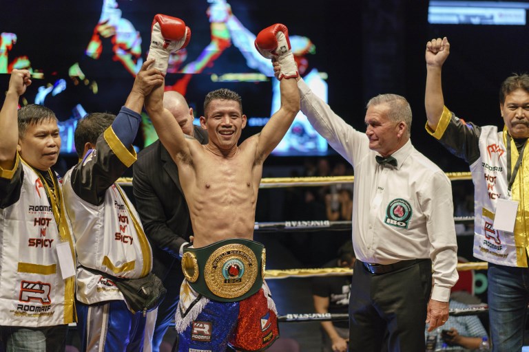 WORLD CHAMPION. Michael Dasmariñas celebrates after winning his biggest fight yet. Photo by Nicholas Yeo/AFP  