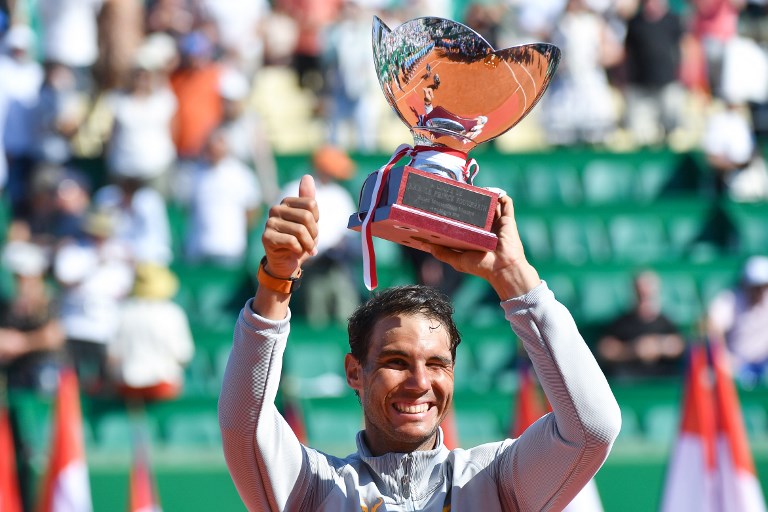 MOMENTUM. 'It's the moment to stay focused and to keep holding that good momentum,' says Spain's Rafael Nadal as he celebrates his Monte Carlo win. Photo by Yann Coatsaliou/AFP 