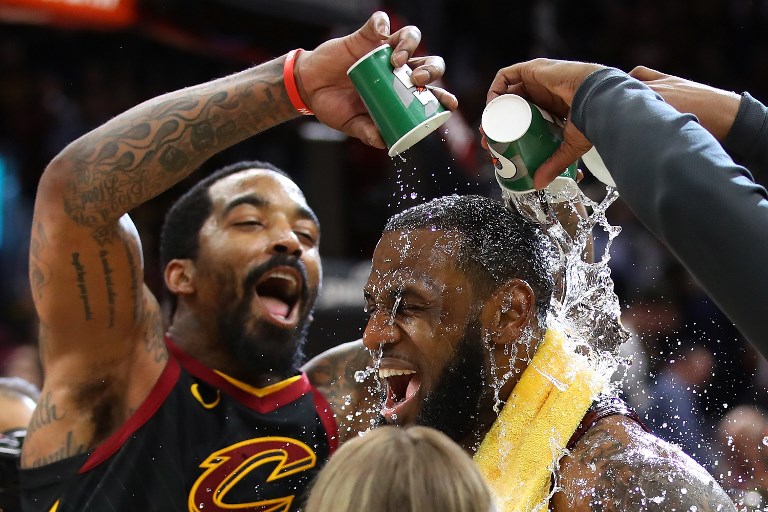 CLUTCH. LeBron James gets showered with water by JR Smith and his teammates after the Cleveland superstar buried the game-winner. Photo by Gregory Shamus/Getty Images/AFP 