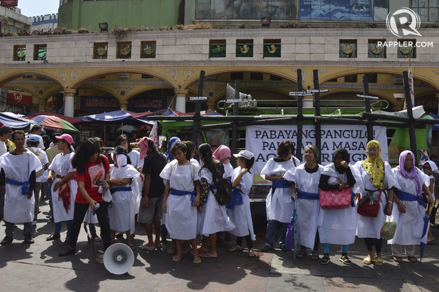 'WOMEN OF GOLGOTHA.' Militant urban poor group KADAMAY gather at the Plaza Miranda to act out the urban poor’s version of the Calvary.  